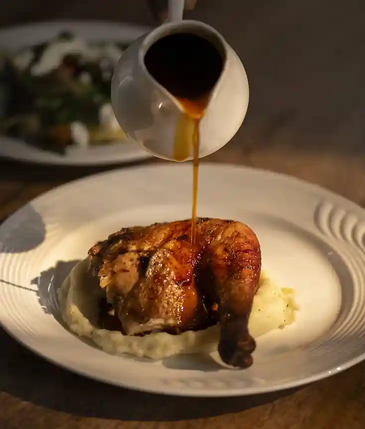 Roast chicken served with mashed potatoes and gravy
